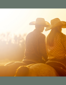 Billede af cowboys i solnedgang